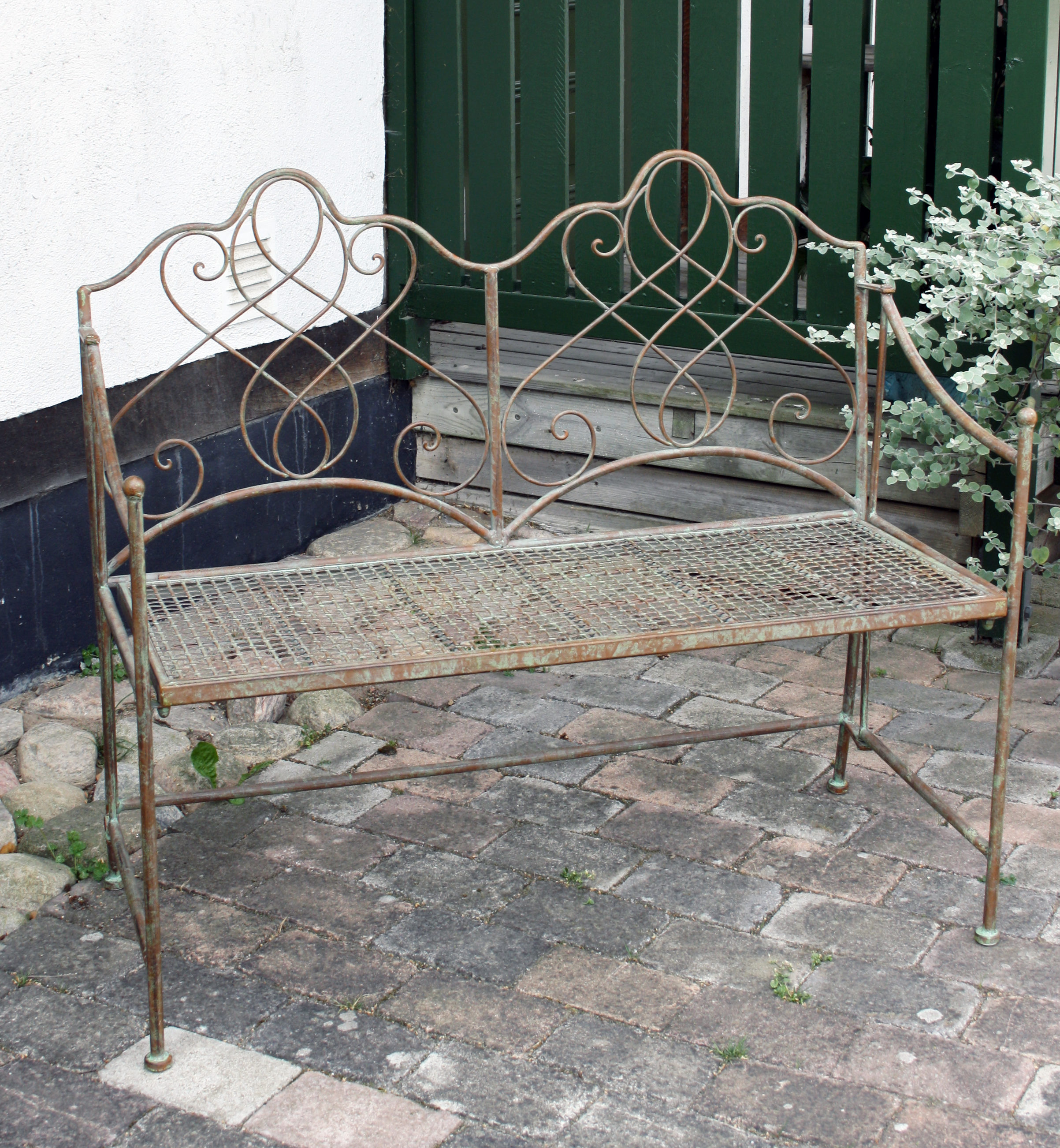 Trädgårdssoffa i smide rost grå grön