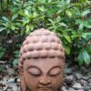 Buddhahuvud trädgårdsdekoration i rost