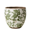 Kruka i stengods med grön blommigt mönster