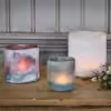 Ljuslykta i frostat glas brun