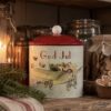 Gammaldags plåtburk med texten God Jul