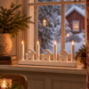 Adventsljusstake med julbock i vitt trä