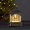 Juldekoration med tomte i snöglob